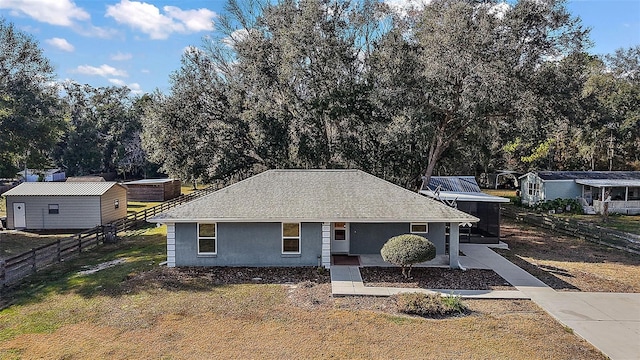 ranch-style home with a front lawn