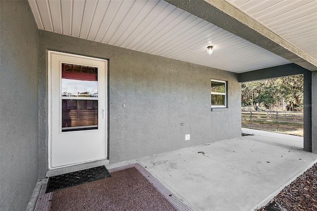 property entrance with a patio