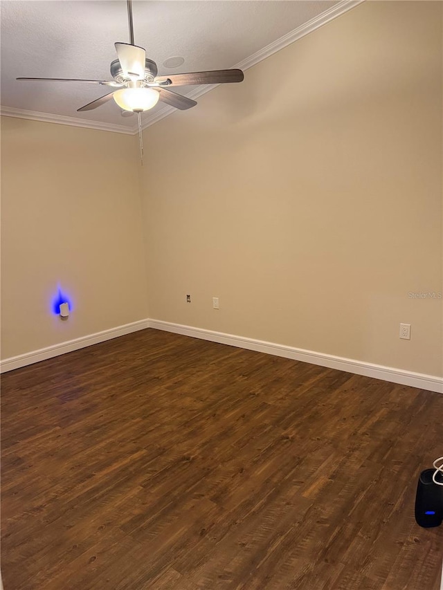 unfurnished room with ceiling fan, baseboards, ornamental molding, and dark wood-style flooring