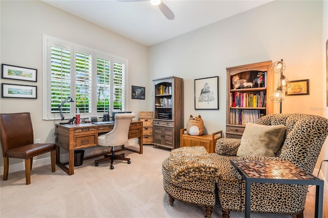 carpeted office space with ceiling fan