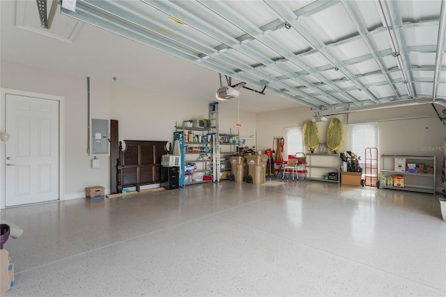 garage with electric panel and a garage door opener