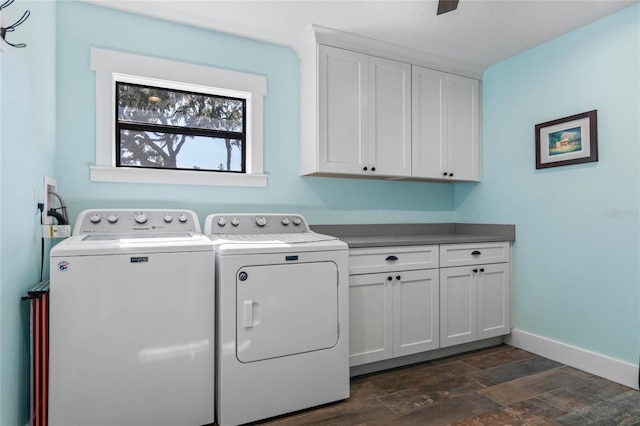 laundry room with cabinet space, dark wood-style floors, baseboards, and washer and dryer