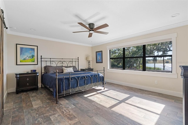 bedroom featuring dark wood finished floors, crown molding, and baseboards