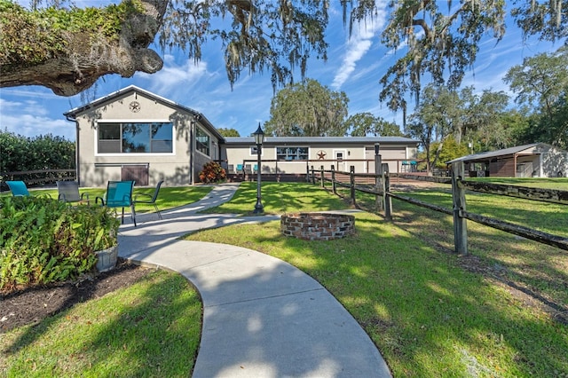 surrounding community with a yard and fence