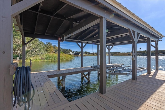 view of dock featuring a water view and boat lift