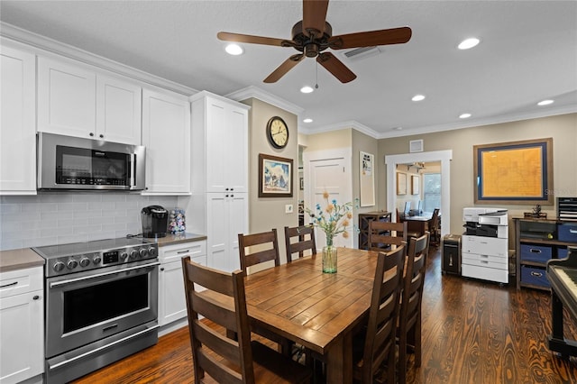 dining area featuring ornamental molding, recessed lighting, visible vents, and dark wood finished floors