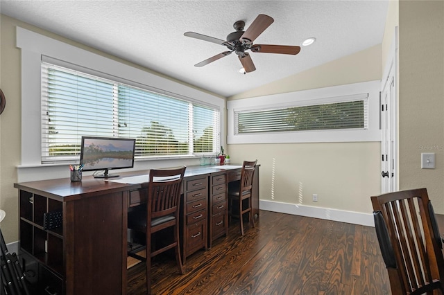 home office with dark wood-style flooring, lofted ceiling, a ceiling fan, a textured ceiling, and baseboards