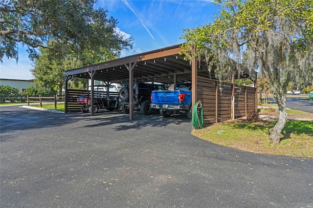 view of car parking with a carport and driveway