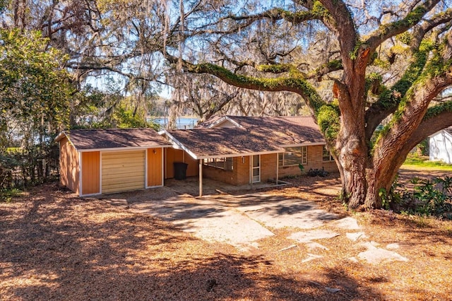 exterior space featuring driveway and brick siding