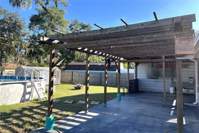 view of car parking with a carport and a lawn