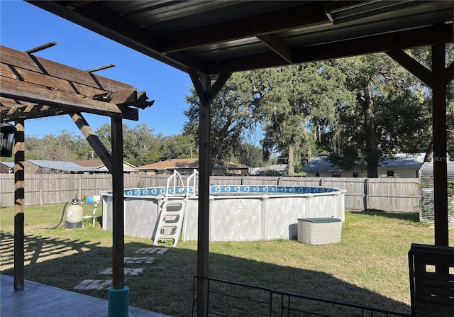 view of yard with a fenced in pool