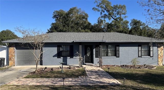 ranch-style house with a garage and a front yard