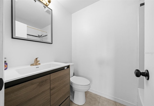 bathroom with walk in shower, vanity, toilet, and tile patterned flooring