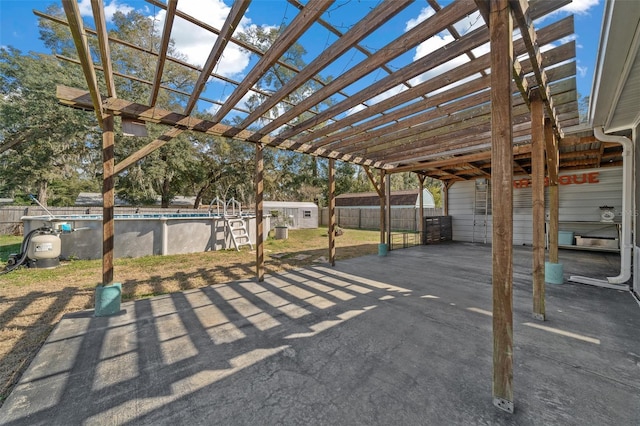 view of patio featuring a pergola and a storage unit