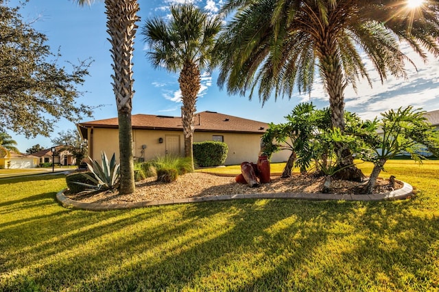 view of property exterior featuring a lawn