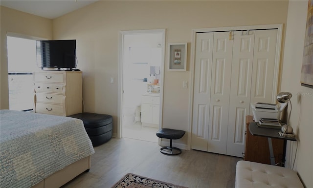 bedroom featuring wood-type flooring and a closet