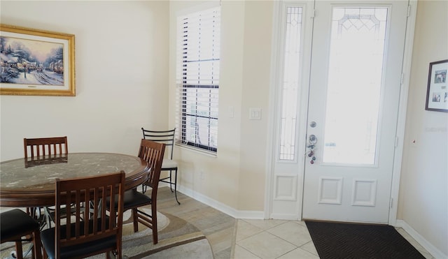 entryway with light tile patterned flooring