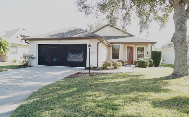 single story home featuring a front lawn and a garage