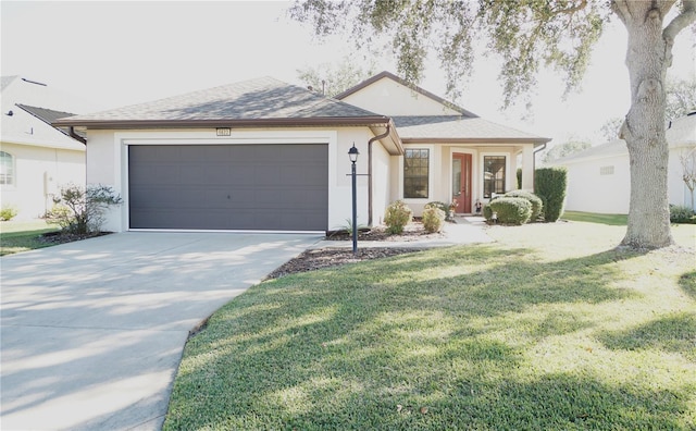 single story home featuring a garage and a front lawn