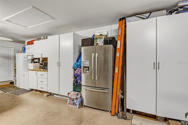 garage with stainless steel fridge