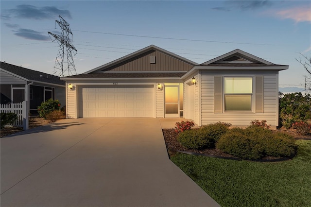 single story home featuring a garage