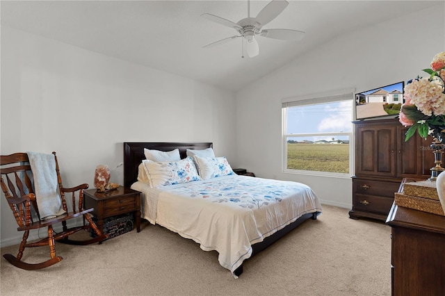 carpeted bedroom with ceiling fan and lofted ceiling