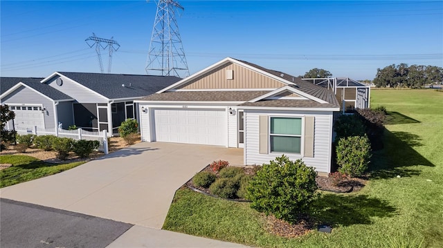 view of front of property with a front lawn and a garage