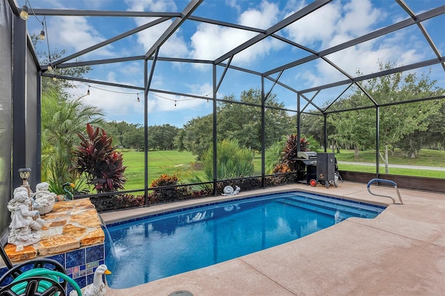 view of swimming pool featuring a patio, pool water feature, and glass enclosure