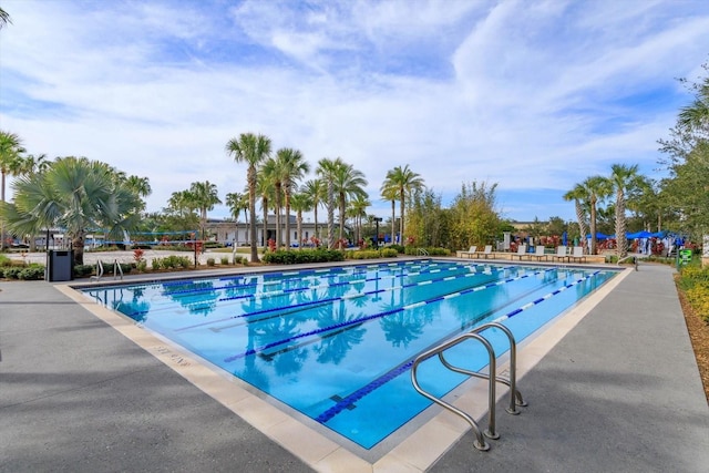 community pool with a patio area