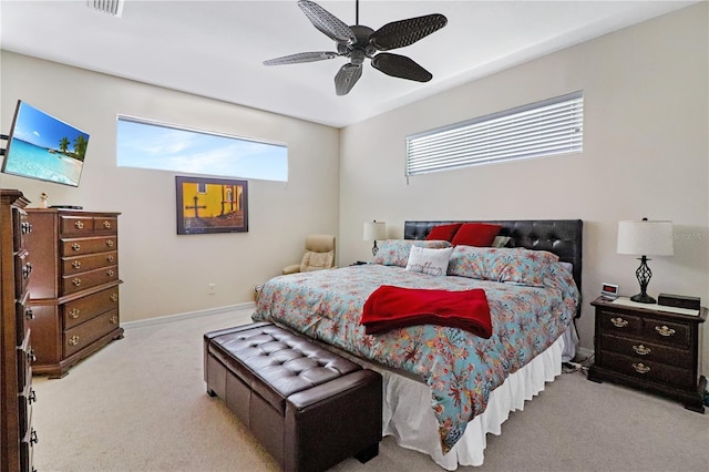 bedroom featuring ceiling fan and light carpet