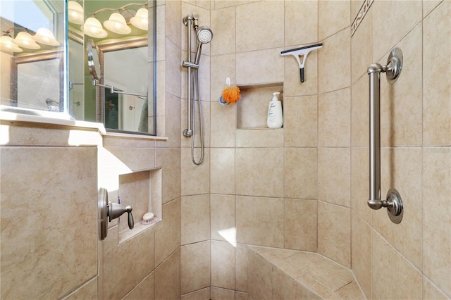 bathroom with a tile shower