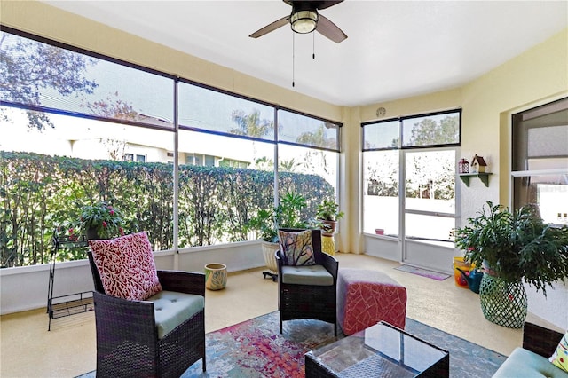 sunroom featuring ceiling fan