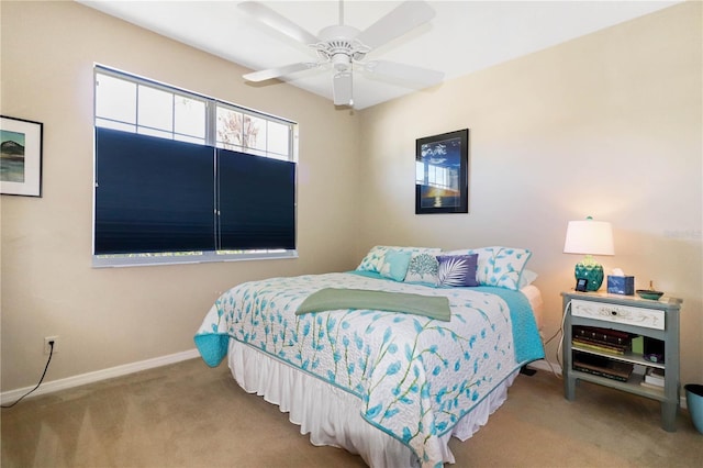 bedroom featuring ceiling fan and light colored carpet