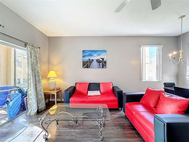 living room with dark hardwood / wood-style flooring, plenty of natural light, and ceiling fan