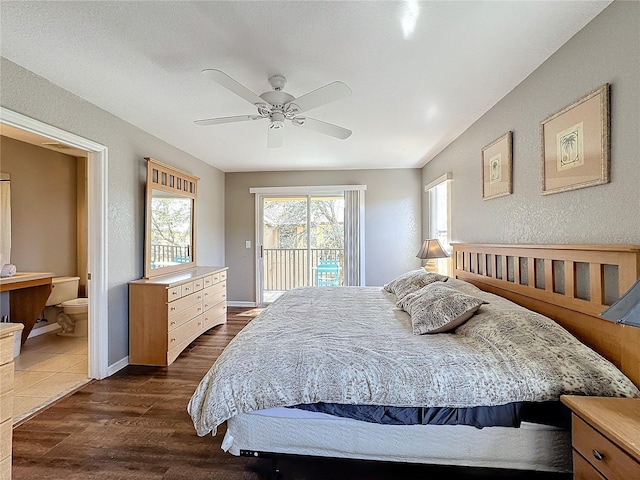 bedroom with ceiling fan, dark hardwood / wood-style flooring, and access to outside