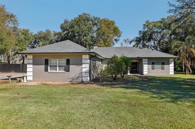 single story home featuring a front yard