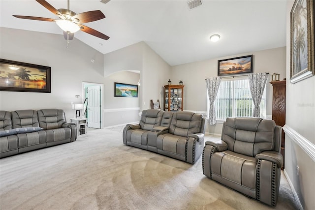 living room featuring light colored carpet, ceiling fan, and lofted ceiling