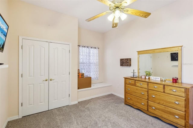 bedroom with light colored carpet, a closet, and ceiling fan