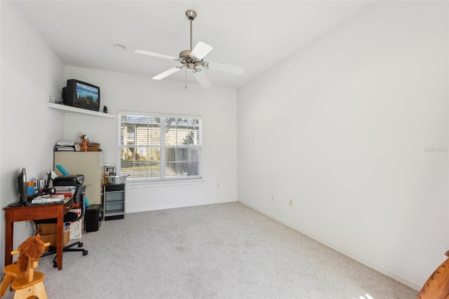 carpeted office with ceiling fan