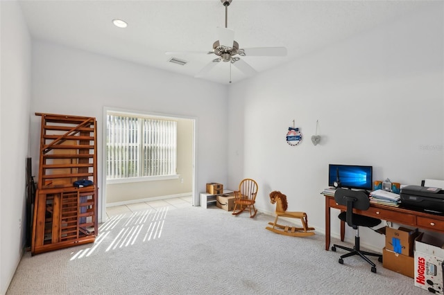 office space featuring light colored carpet and ceiling fan