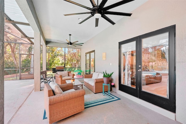 sunroom / solarium featuring ceiling fan, french doors, and vaulted ceiling