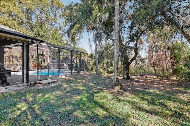 view of yard featuring a lanai