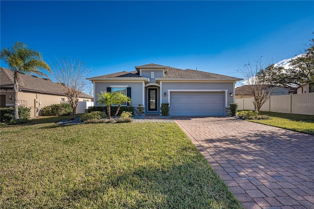 view of front facade featuring a front yard and a garage