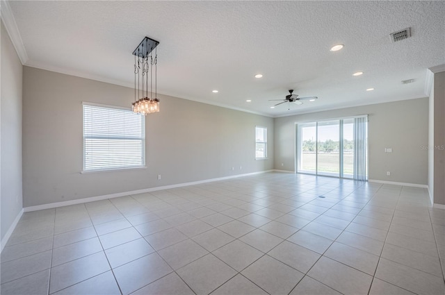 tiled empty room with a textured ceiling, ceiling fan with notable chandelier, and crown molding