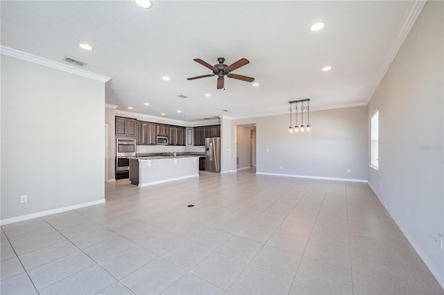 unfurnished living room featuring light tile patterned floors, ceiling fan, crown molding, and sink