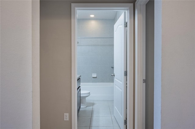 full bathroom with tile patterned flooring, vanity, toilet, and plus walk in shower