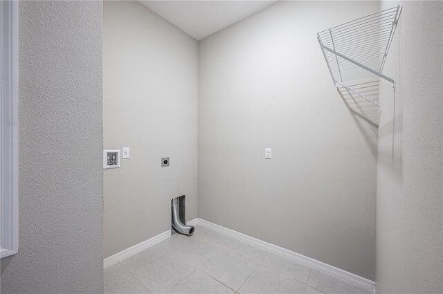 laundry area with light tile patterned floors, washer hookup, and hookup for an electric dryer