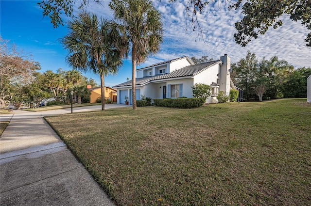 view of home's exterior with a lawn and a garage