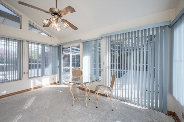 unfurnished sunroom featuring ceiling fan and lofted ceiling