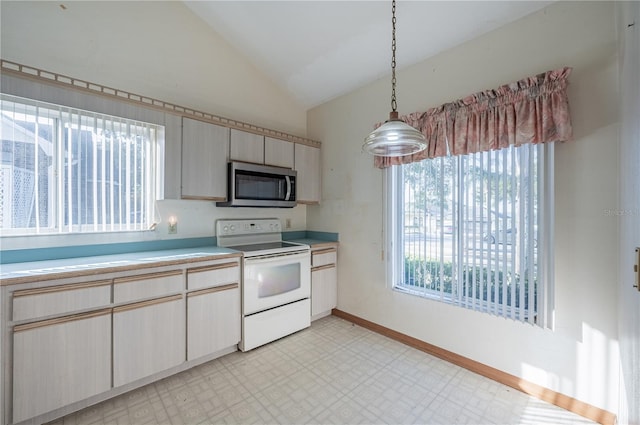 kitchen with electric range, pendant lighting, and lofted ceiling